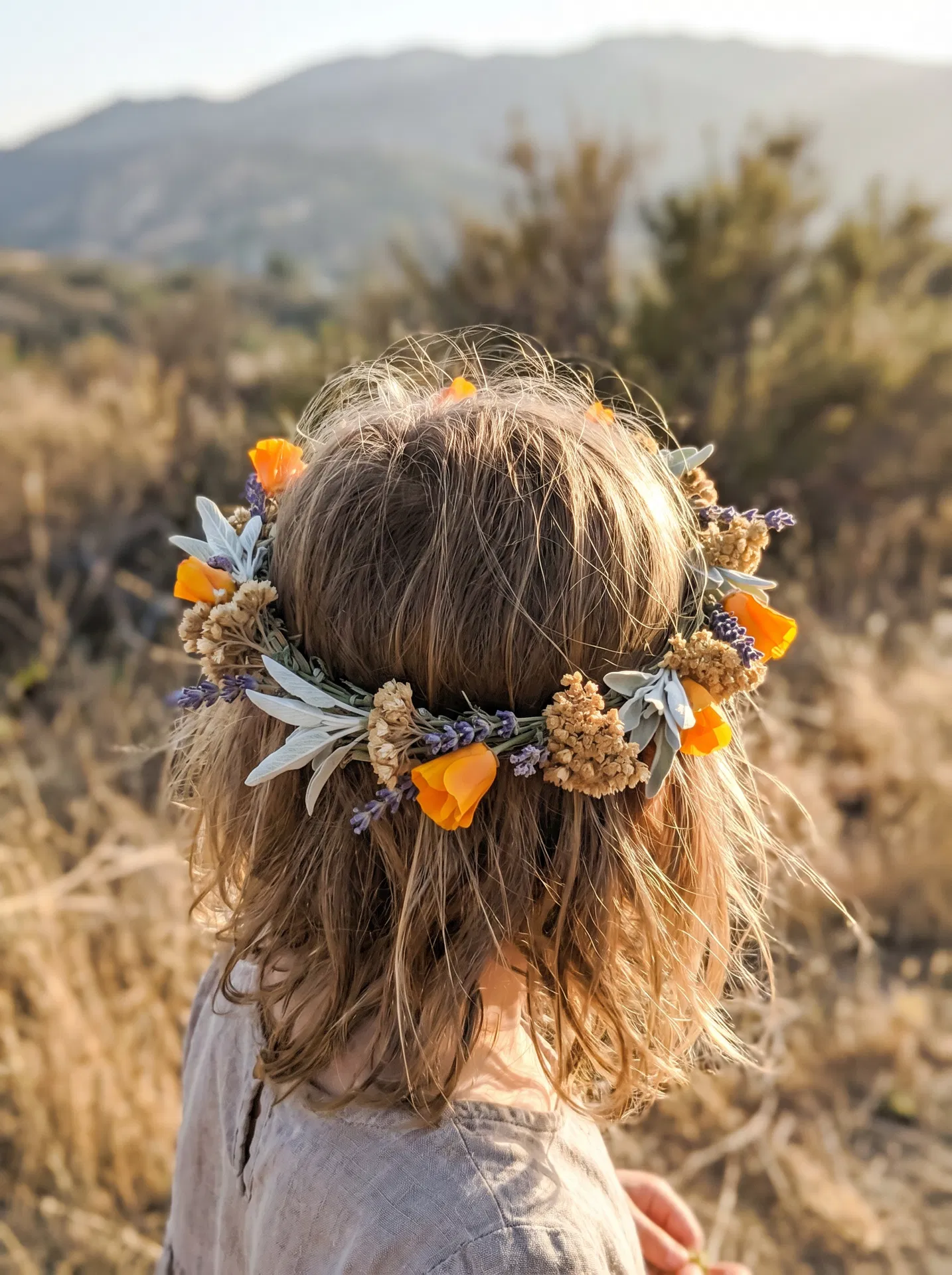 Child with flower crown at Sandersprouts Nature School